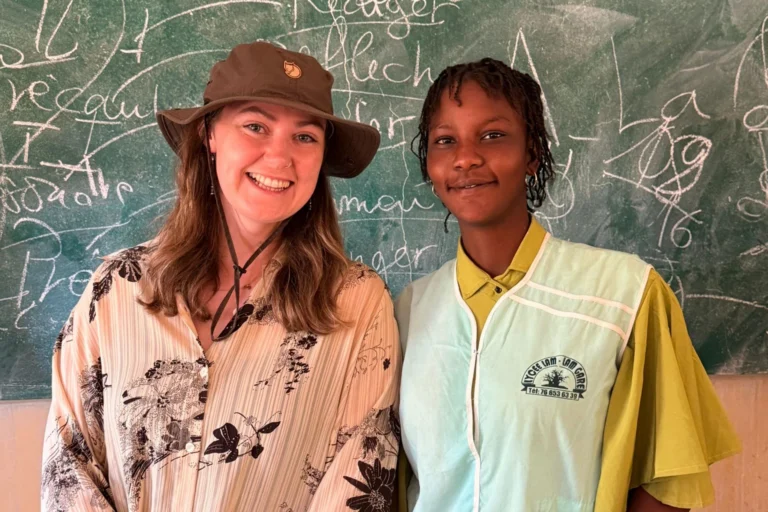 Educational travel adviser with a Senegalese student during a school visit in Senegal