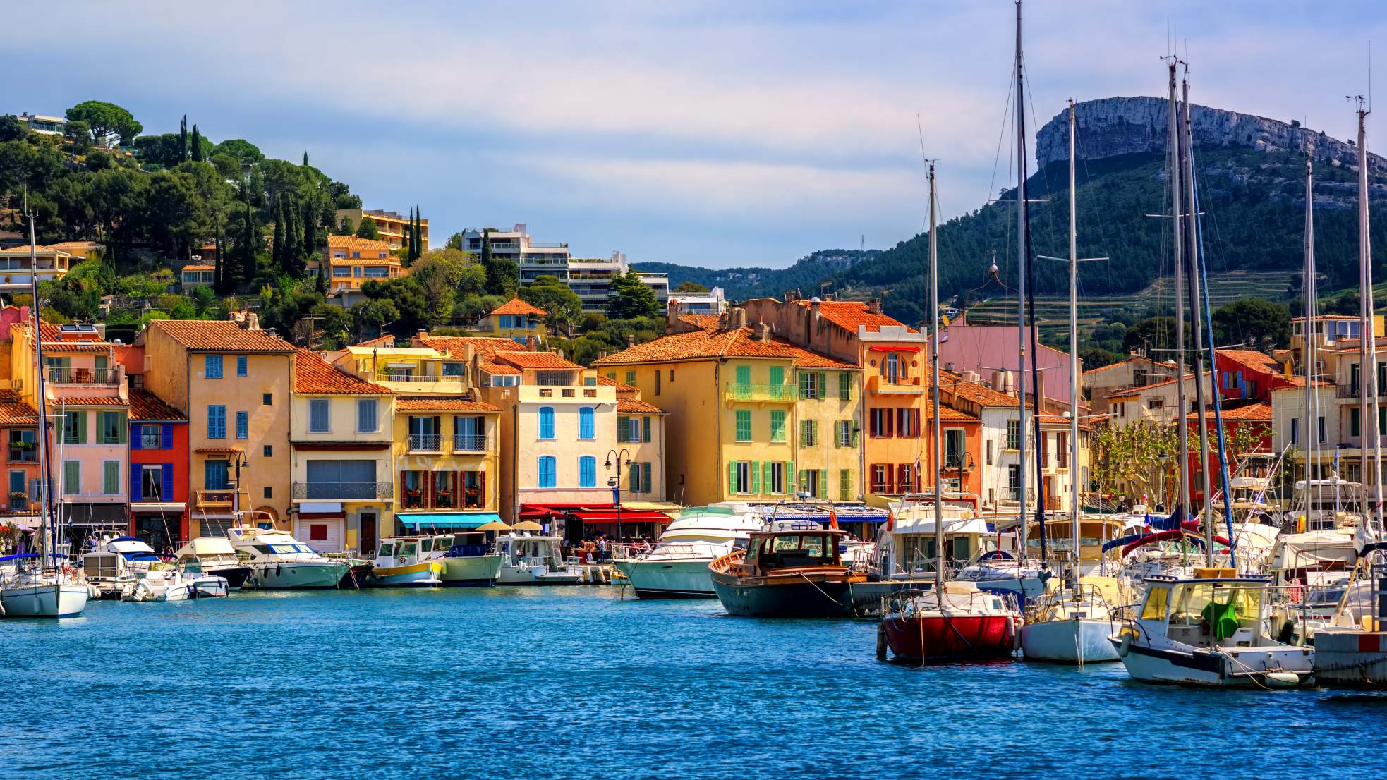 Colorful houses lining the seaport in Cassis, France