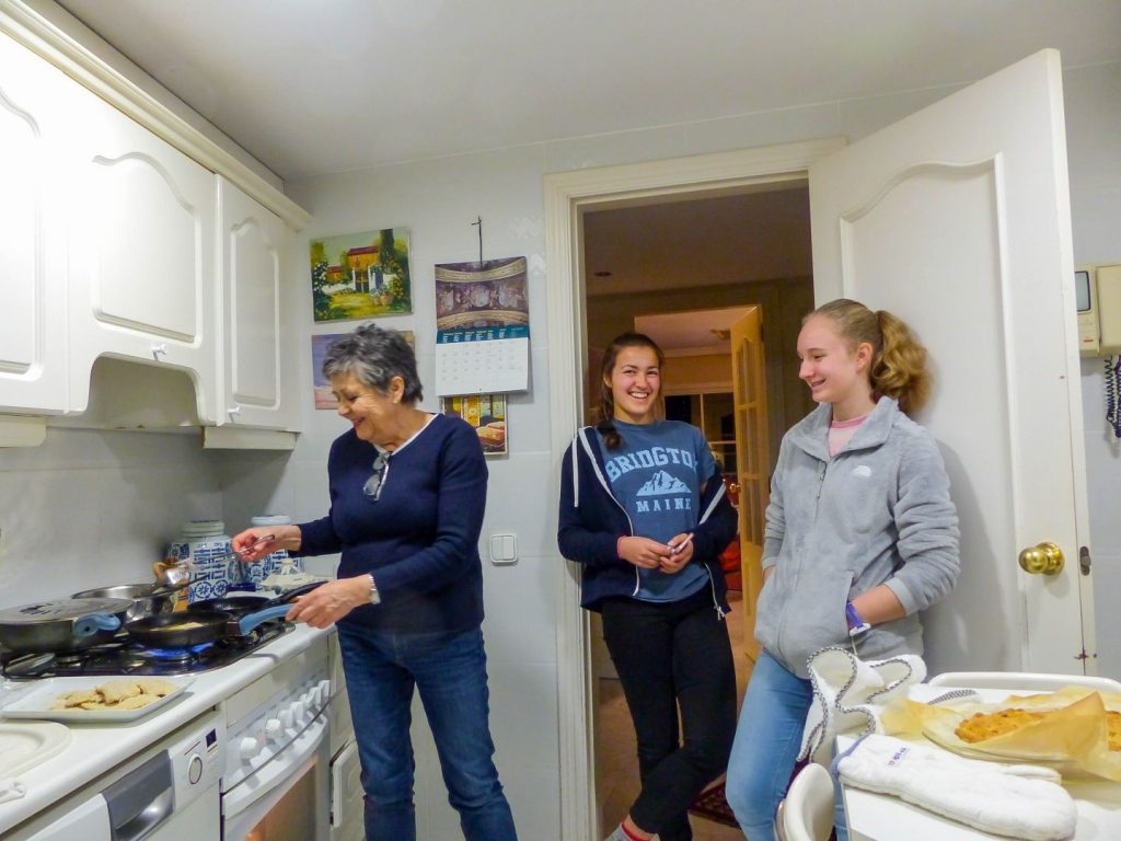 Nina and Host Students preparing for dinner together