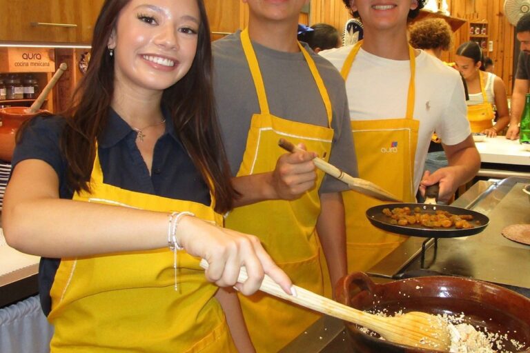 Students preparing Mexican food during a hands-on cooking class in Mexico City