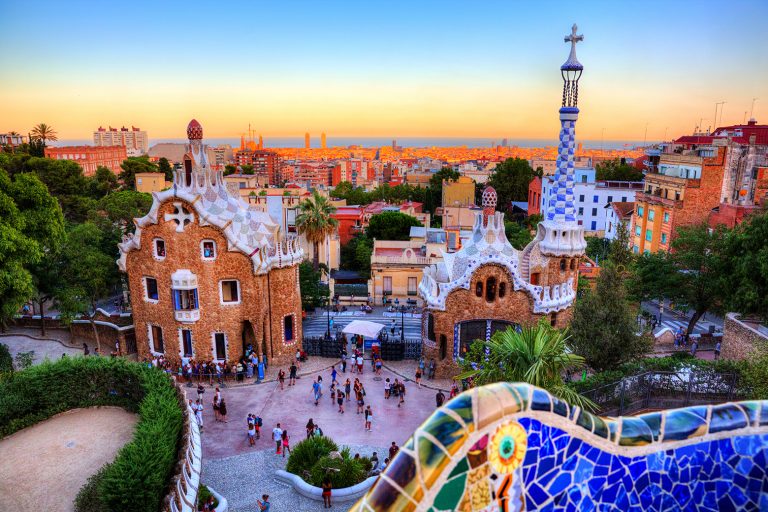 Spain-Barcelona-Gaudi-Parque-Guell-with-City-in-background-sunset