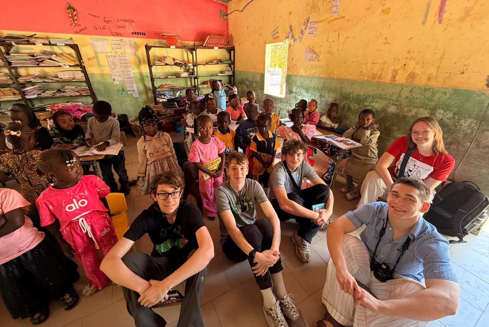 American students visiting a local classroom during a Senegal educational tour